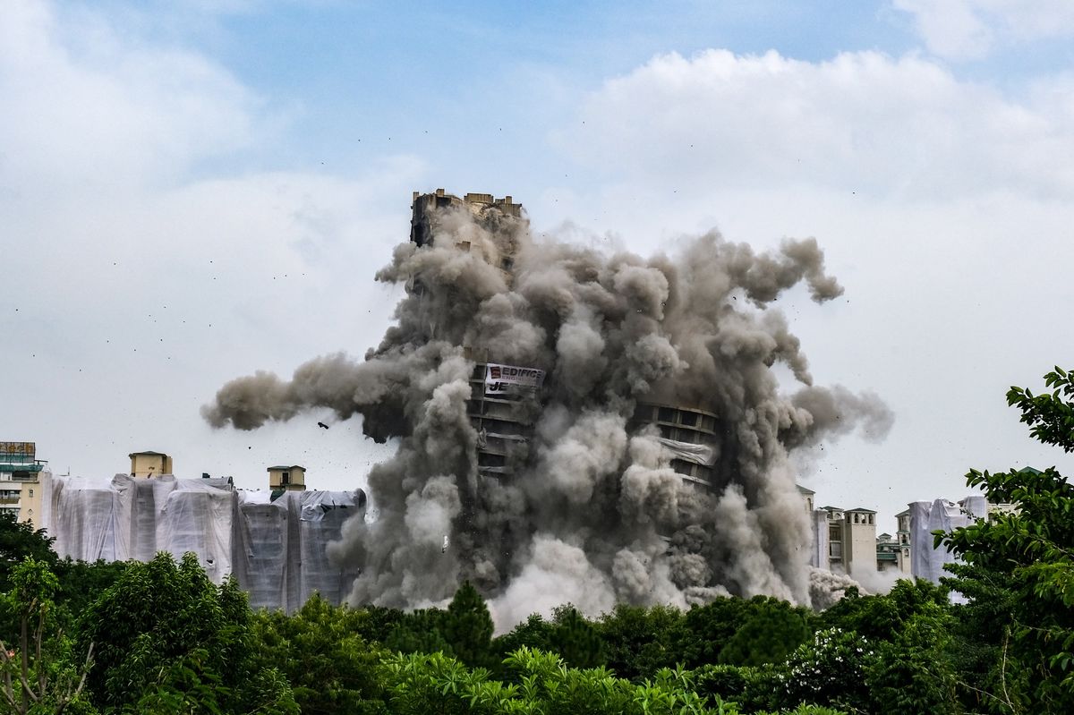 Why did India demolish the new luxury apartments worth$ 87 million?